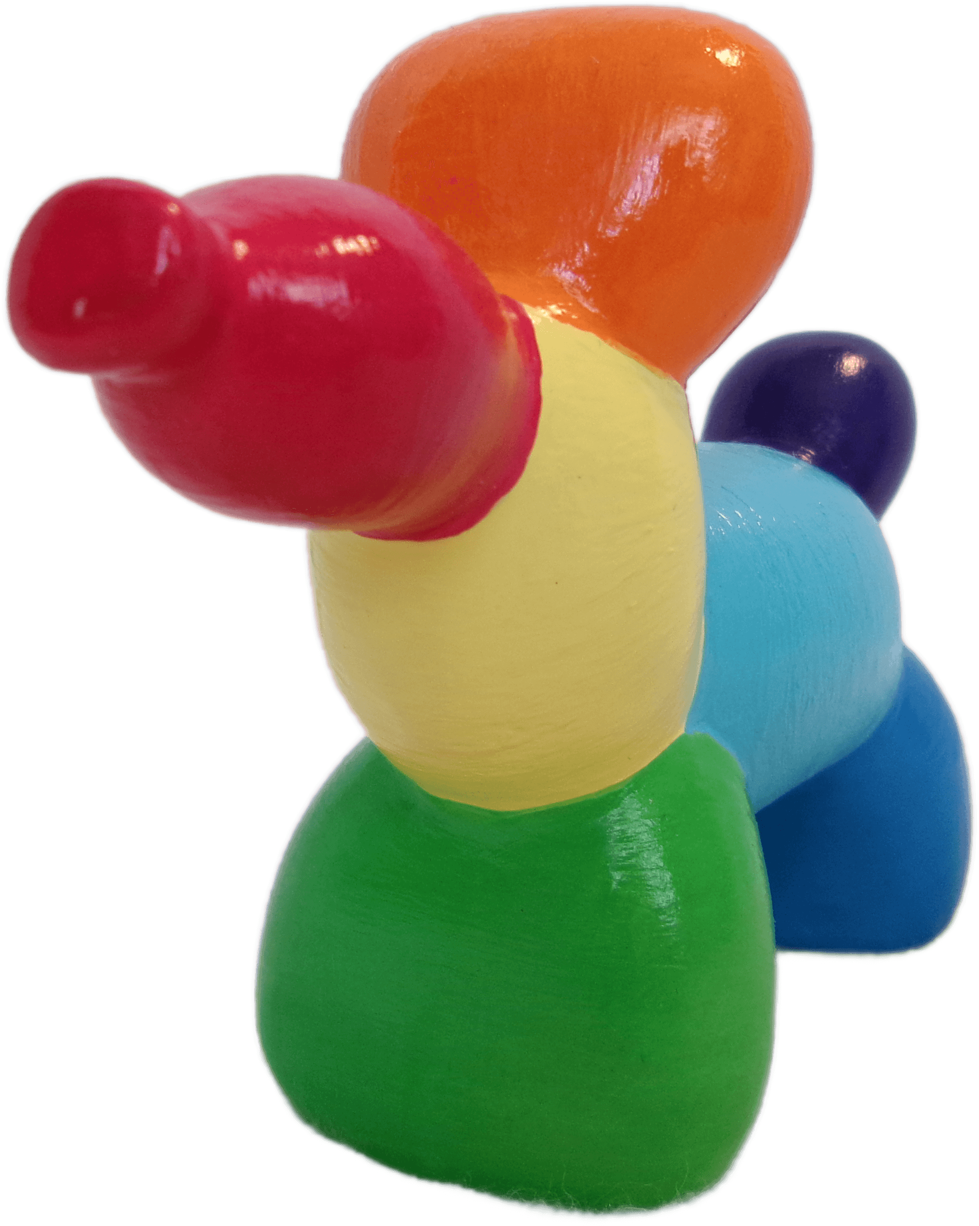 A rainbow ceramic balloon dog viewed from an angle.